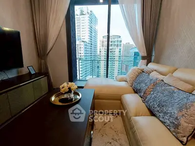 Luxurious living room with city view, elegant decor, and comfortable seating in high-rise apartment.