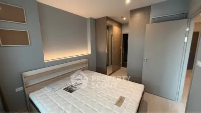 Modern bedroom with sleek design and ample storage space