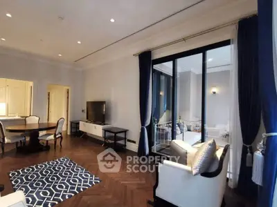 Elegant living room with modern decor and large windows in luxury apartment