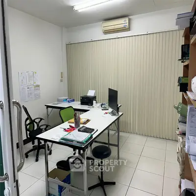 Modern office space with desks, chairs, and air conditioning, ideal for productivity and comfort.