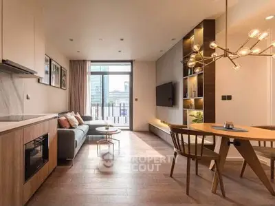 Modern living room with open kitchen, stylish lighting, and city view balcony in luxury apartment.