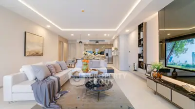 Luxurious open-plan living room with modern decor and spacious layout.