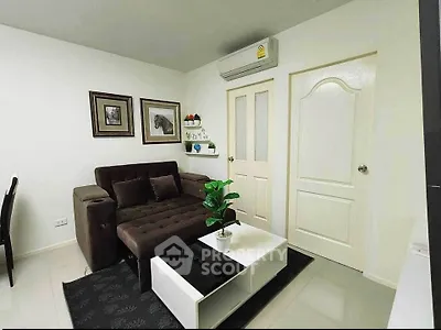 Modern living room with stylish decor and comfortable seating in a cozy apartment.