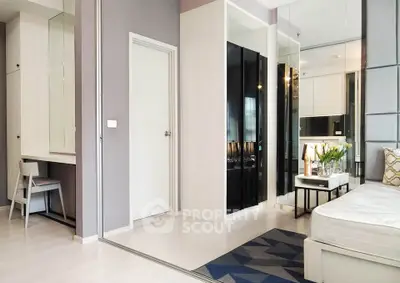 Modern living room with sleek design and stylish decor, featuring a cozy seating area and elegant furnishings.