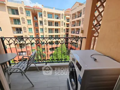 Charming balcony with washing machine and scenic view of Mediterranean-style building