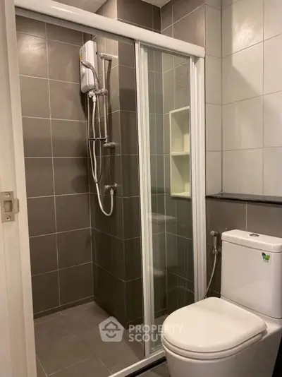 Modern bathroom with glass shower and sleek tile design