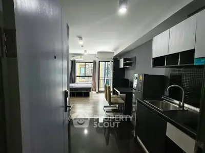 Modern open-layout apartment with sleek kitchen and spacious living area