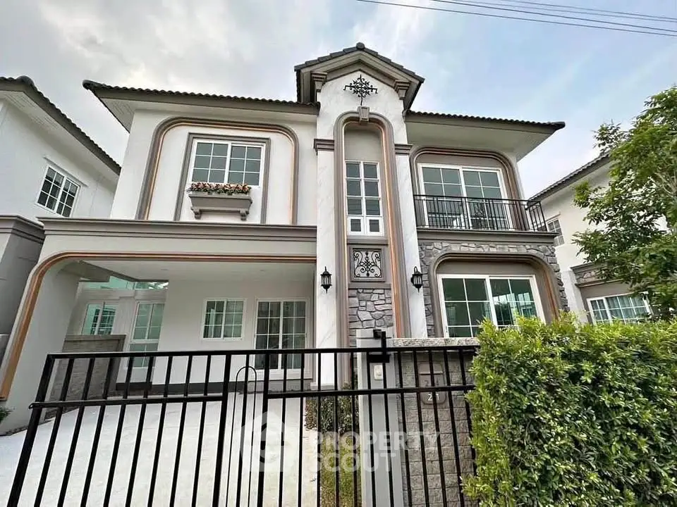 Elegant two-story house with modern architecture and lush greenery, perfect for family living.