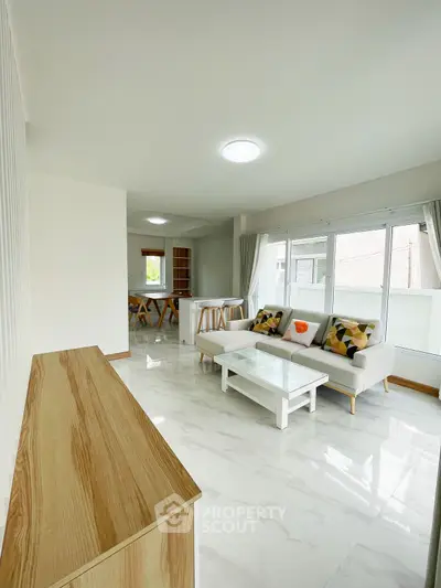 Spacious modern living room with elegant decor and natural light