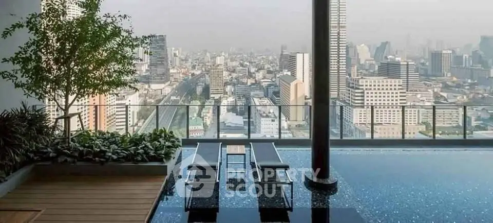 Stunning rooftop pool with breathtaking city skyline view, perfect for luxury urban living.