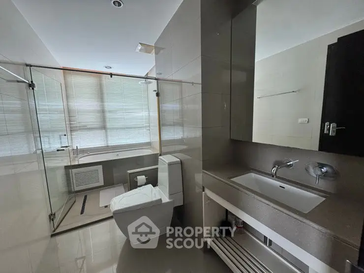 Modern bathroom with glass shower and sleek fixtures
