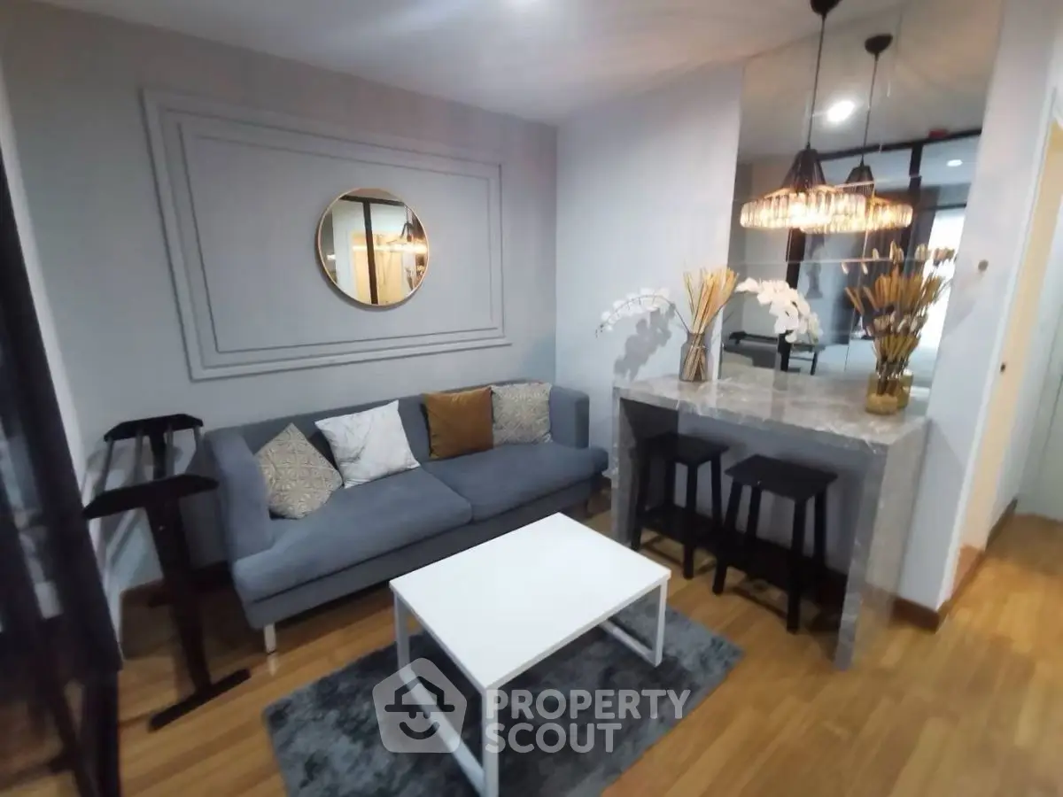 Stylish modern living room with elegant decor and cozy seating area.