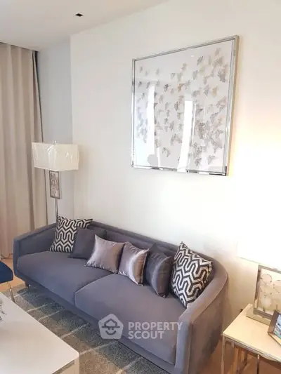 Elegant living room with plush gray sofa and stylish decor