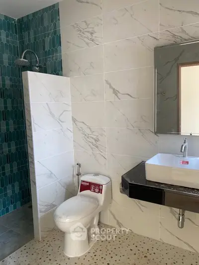 Modern bathroom with elegant tile design and sleek fixtures