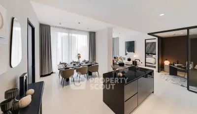 Luxurious open-plan living and dining area with modern kitchen island and elegant decor.
