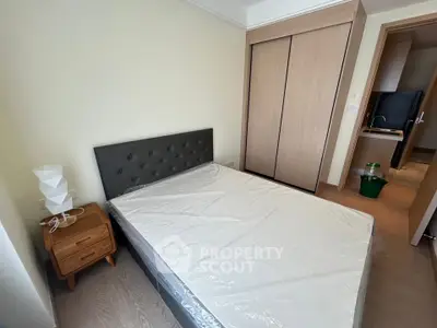 Modern bedroom with stylish furniture and ample storage space