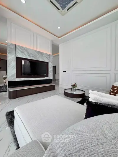 Luxurious modern living room with elegant marble accents and plush seating