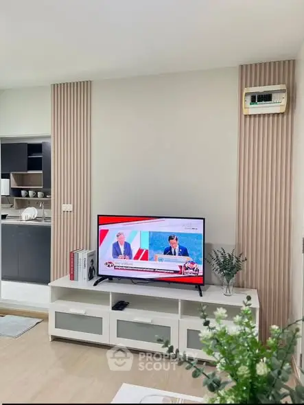 Modern living room with stylish TV stand and decorative wall panels