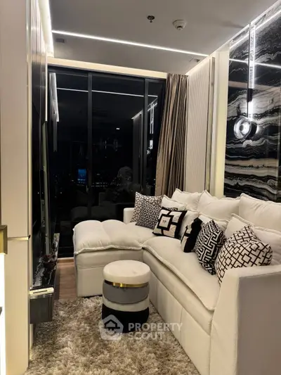 Luxurious modern living room with plush white sofa and elegant decor