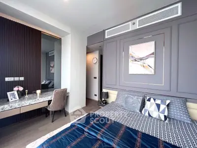 Luxurious bedroom with elegant decor and stylish furnishings in modern apartment.