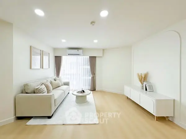 Spacious modern living room with elegant decor and natural light