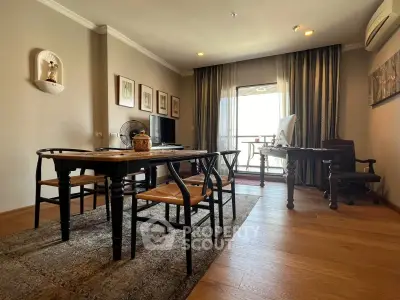 Spacious living room with elegant wooden flooring and modern furniture, featuring a balcony view.