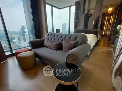 Luxurious high-rise bedroom with panoramic city views and elegant furnishings.