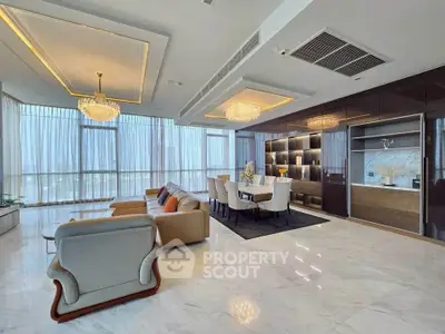 Luxurious modern living room with elegant chandeliers and floor-to-ceiling windows.