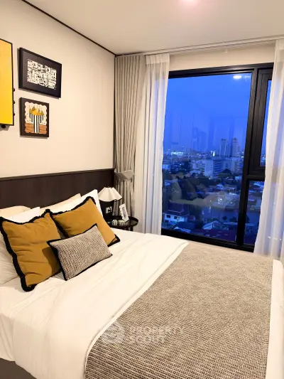 Modern bedroom with city view, stylish decor, and cozy ambiance in urban apartment.