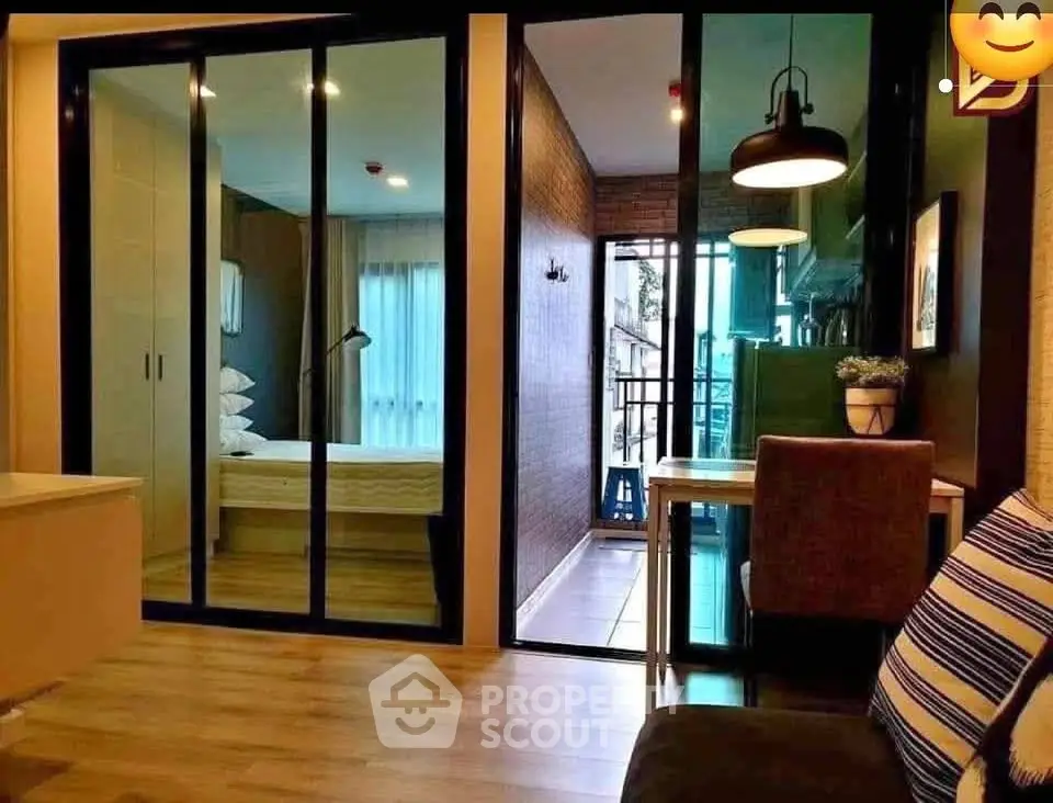 Modern apartment interior with glass partitions and cozy decor