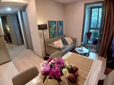 Charming living room with cozy seating and vibrant decor in modern apartment.