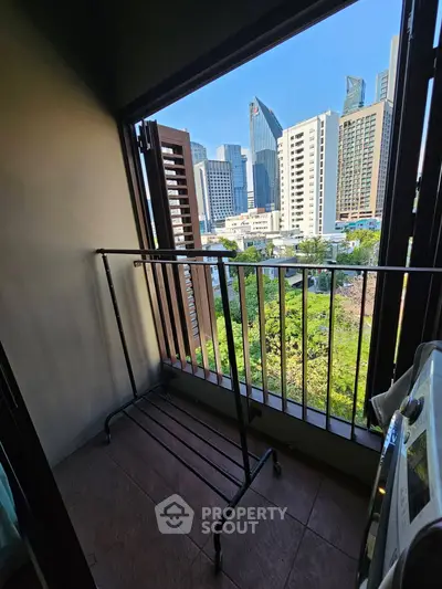 Charming balcony with city skyline view, perfect for urban living enthusiasts.