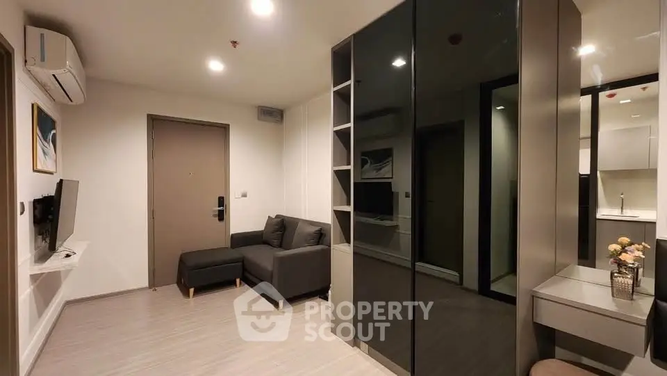 Modern living room with sleek furniture and stylish decor in a contemporary apartment.
