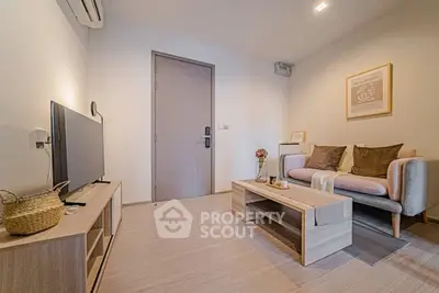 Modern living room with stylish decor and cozy seating area.
