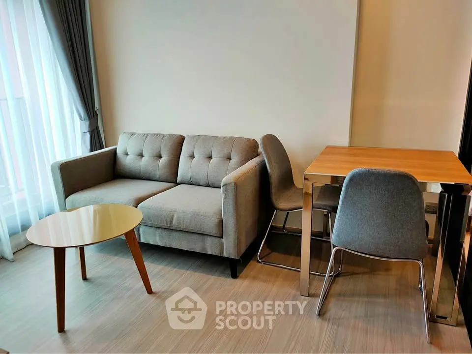 Modern living room with stylish sofa and dining table in a cozy apartment.