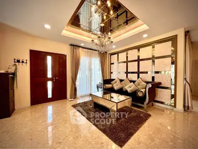 Luxurious living room with elegant decor and chandelier lighting