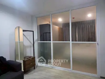 Modern living room with sliding glass doors and sleek furniture