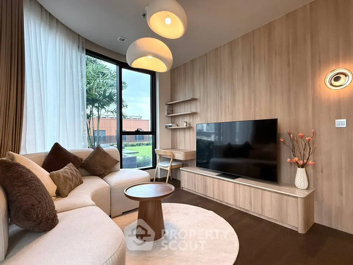 Stylish modern living room with large TV and cozy seating area
