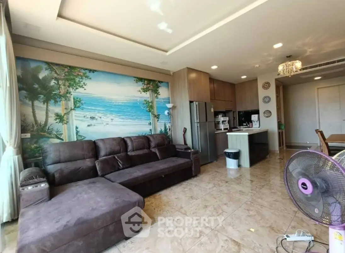 Spacious living room with sectional sofa and open kitchen in modern apartment