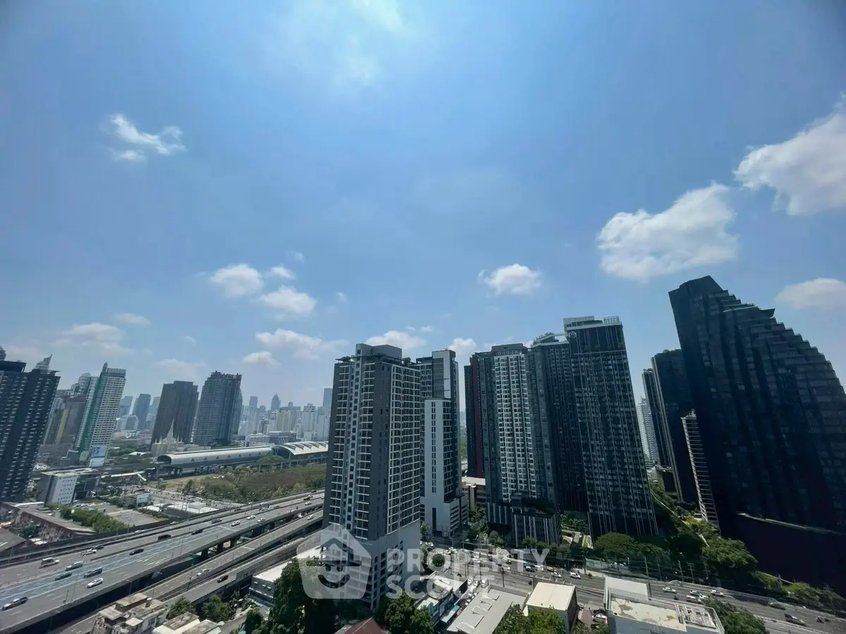 Stunning cityscape view of modern high-rise buildings under a clear blue sky.