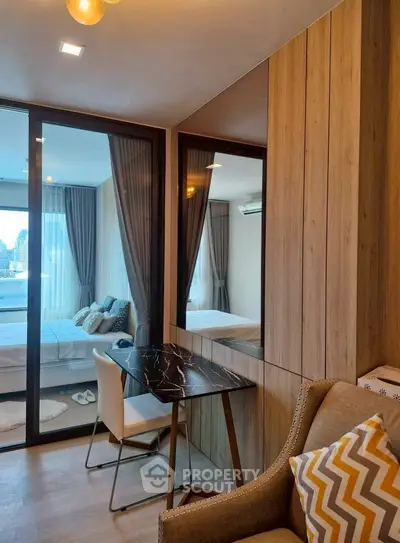 Modern bedroom with stylish decor and glass partition for a chic urban living experience.