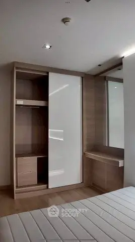 Modern bedroom with sleek built-in wardrobe and minimalist design