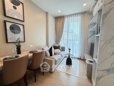 Modern living room with stylish decor and natural light in a contemporary apartment.
