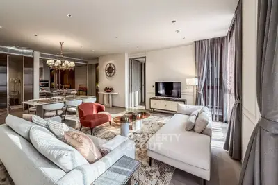 Luxurious living room with elegant decor and open layout, featuring plush seating and abundant natural light.