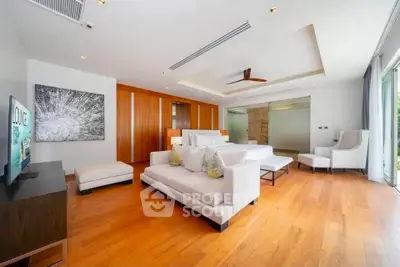 Spacious modern living room with wooden flooring and stylish furniture