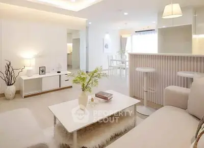 Modern living room with elegant decor and open layout, featuring cozy seating and stylish lighting.