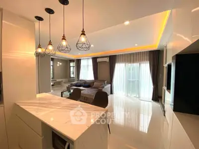 Spacious modern living room with elegant lighting and large windows