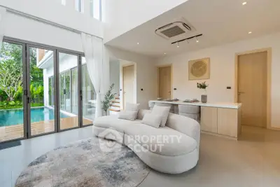 Luxurious living room with pool view and modern decor in a contemporary home