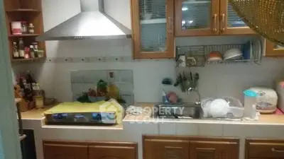 Cozy kitchen with gas stove and ample storage space