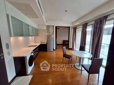 Spacious modern living room with open kitchen and large windows